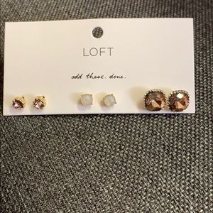 Set of three colored gem earring studs.